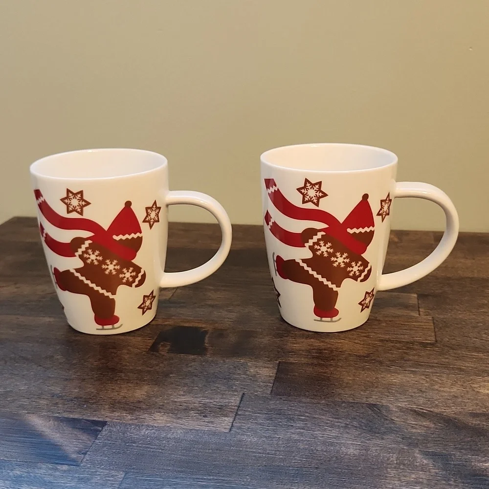 Set of ice skating gingerbread man mugs Crate & Barrel